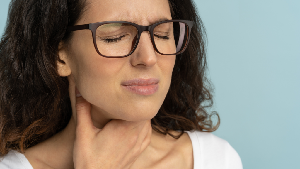 Woman suffering with hoarse/raspy voice