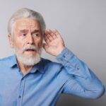 An old person facing hearing loss