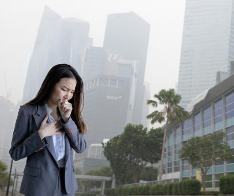 Lady coughing due to the haze in Singapore